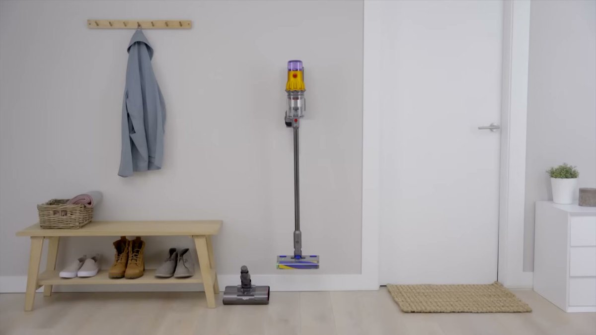 Dyson V12 Detect Slim cordless vacuum standing in a clean home entryway