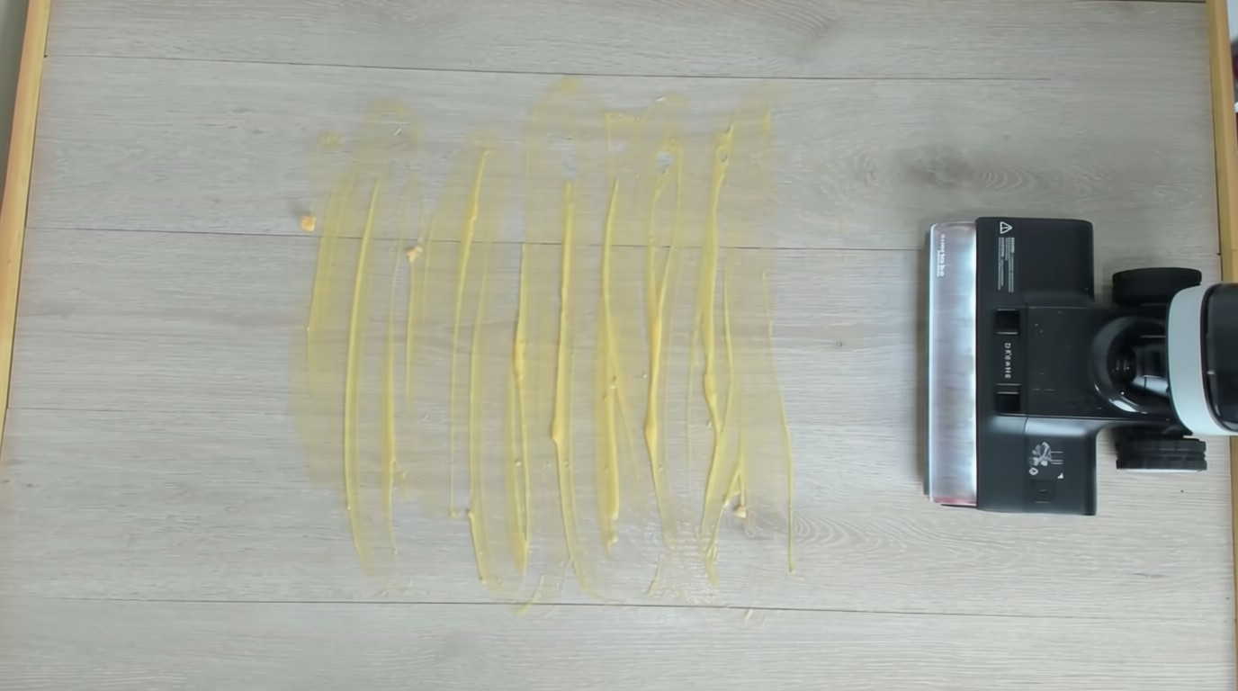 Dreame H14 Pro cleaning a spill on hardwood floor