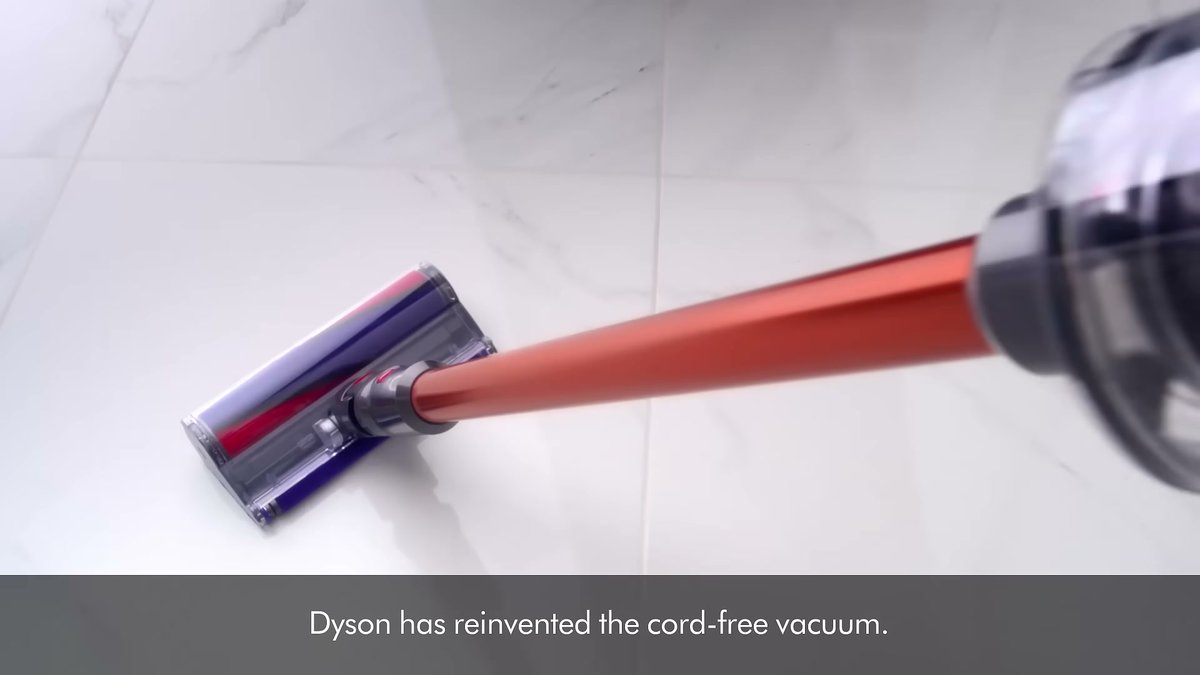 Dyson V10 Absolute (Refurbished/New) cord-free vacuum cleaning a white tiled floor