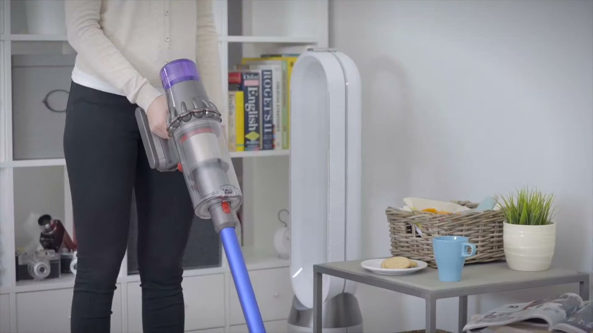 Dyson V11 Replacement Battery in use during cleaning in a living room setting