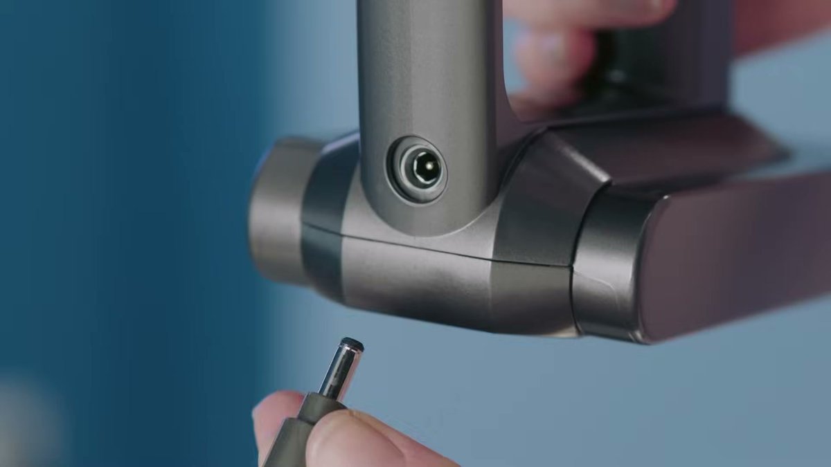 Close-up of Dyson V11 Torque Drive charging port on handle