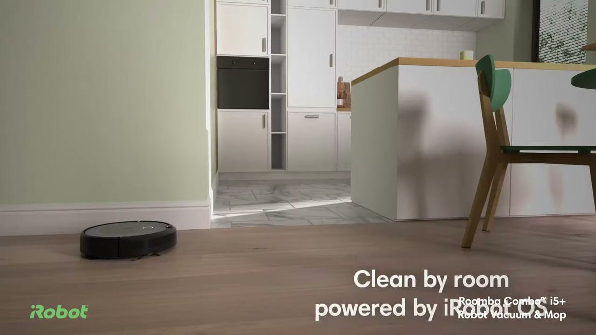 iRobot Roomba i5+ cleaning hardwood floor in modern kitchen