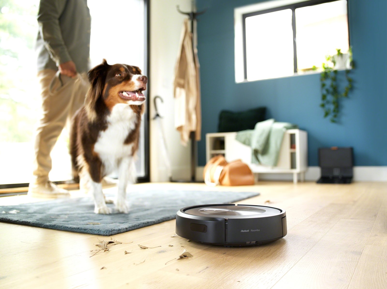 iRobot Roomba j9+ in entryway with dog